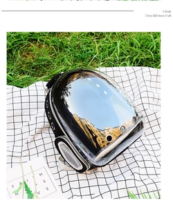 Detail of black pet carrier with panoramic transparent window and side ventilation holes