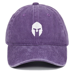 Close-up of embroidered Spartan helmet logo on purple washed cotton baseball cap