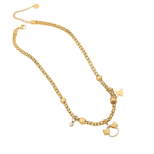 Golden woven chain necklace featuring a butterfly pendant and sparkling rhinestone charm