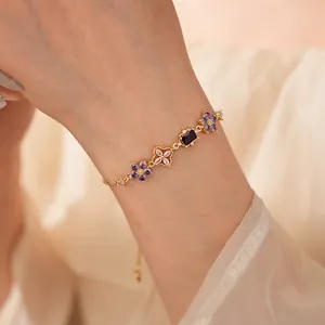 Elegant gold flower bracelet with purple zircon stones and adjustable sliding clasp for women