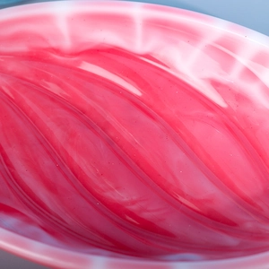 Macro shot of high-quality resin tray with deep pink and white marble texture details