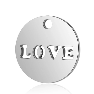 Close-up of polished stainless steel round charm with LOVE cutout and hanging hole