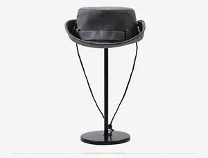 Detail of dark grey outdoor bucket hat showing breathable metal eyelets and drawstring