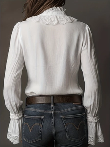 Elegant white lace long-sleeved shirt with delicate ruffled edges and textured pleats