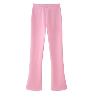 Detailed view of pink flared trousers with smooth texture and central seam design