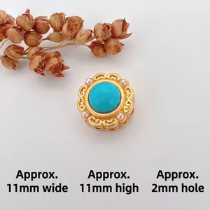 Macro view of gold cat-eye stone bead with pearl accents and 11mm dimensions