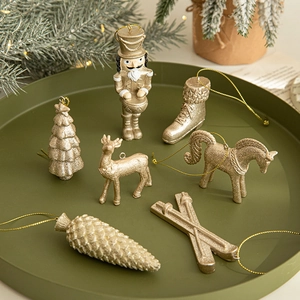 Champagne gold Christmas tree ornaments set including reindeer and nutcracker figures