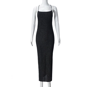 Detail view of shimmering black glitter fabric on a sleek bodycon evening maxi dress
