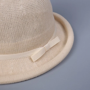 Beige knit sun hat for women with elegant satin bow detail and breathable texture
