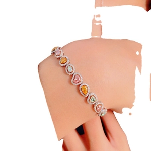 Luxurious multi-color gemstone bracelet with heart, pear and oval halo diamonds