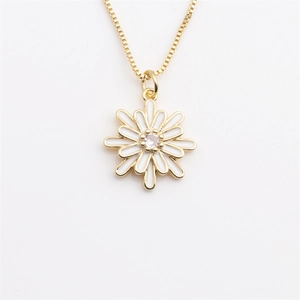 Detailed view of daisy pendant necklace with white enamel petals and golden box chain