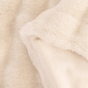 Luxurious cream faux rabbit fur blanket with ultra-thick plush texture for sofa comfort