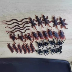 Miniature brown plastic toy set including fake snakes, spiders, and insects for Halloween