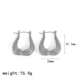 Detail view of silver U-shaped hoop earrings with striped texture and dimensions labels