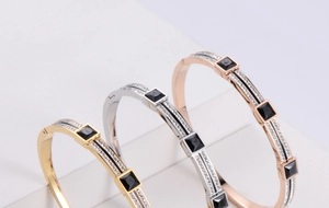 Three-color geometric bangles with square black stones and pavé set micro zircons