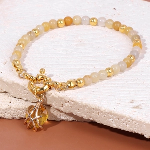 Detail of beaded bracelet with 4mm yellow stones, OT toggle clasp, and heart pendant