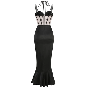Detail of the black corset-style back with mesh inserts and fishtail hemline design