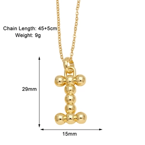 Detail showing letter I pendant necklace size 29mm by 15mm in polished gold finish