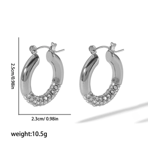 Detail view of silver hoop earrings with clear cubic zirconia and dimensions 2.5cm by 2.3cm