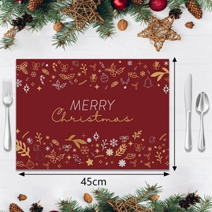 Close-up of 45cm Christmas placemat with reindeer and snowflake prints on wood background