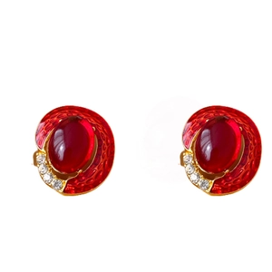 Vintage style oval red gemstone earrings with gold frame and cubic zirconia accents