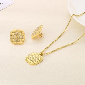 Detail of 18K gold plated square pendant necklace and earrings with textured diamond inlay