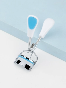 Detailed view of the sky blue stainless steel eyelash curler with ergonomic handle