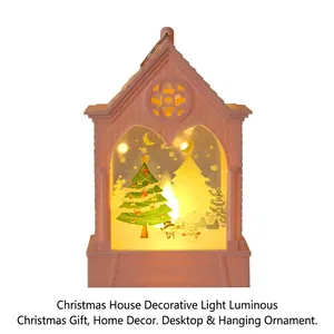 Pink Christmas house lantern with hanging ring and glowing festive scene interior