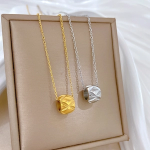Titanium steel waist pendant necklaces in gold and silver finish on display stand