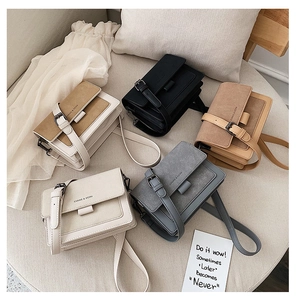 Detailed collection of matte leather crossbody bags in five colors on a soft textile backdrop