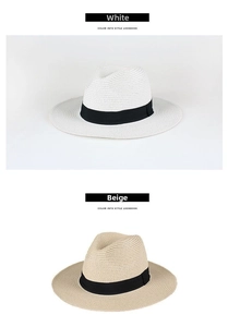Dettaglio dei cappelli in paglia bianco e beige con nastri decorativi neri da estate