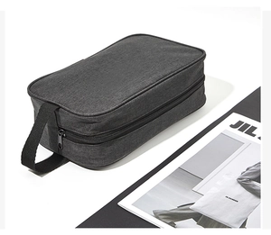 Detail of waterproof Oxford cloth wash bag with side handle and sturdy black zipper