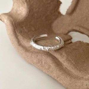 Irregular textured 925 sterling silver open ring with organic lava surface design