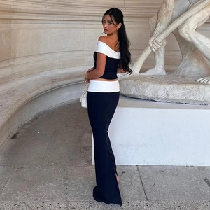 Detail of trendy black and white contrast tube top and slit maxi skirt set on model