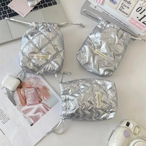 Silver quilted drawstring bag with bow and heart patterns for instant cameras