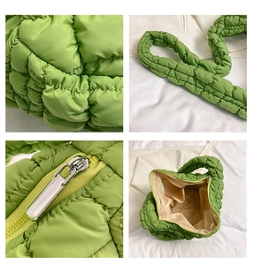 Detailed views of green quilted puffer bag featuring silver zipper and textured fabric