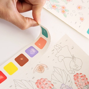 Portable watercolor painting book for kids featuring built-in paints and creative line drawings