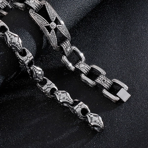 Macro detail of gothic stainless steel bracelet with cross motifs and white zircon stones