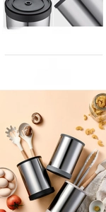Close-up of a rotating stainless steel utensil holder with brushed metal texture