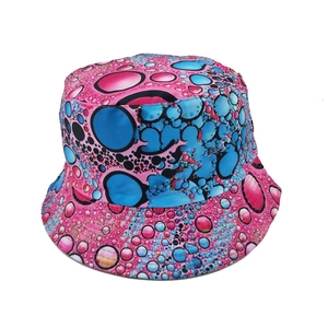Double-sided reversible bucket hat with pink and blue abstract bubble print pattern