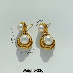 Detailed view of gold twisted ribbon pearl earrings with size dimensions 34mm by 17mm