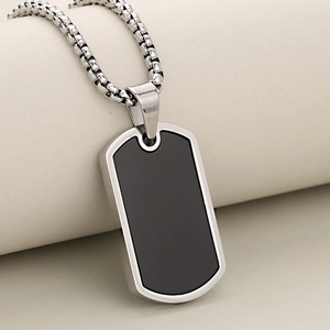 Polished silver stainless steel dog tag necklace with a sleek black inlay on a box chain