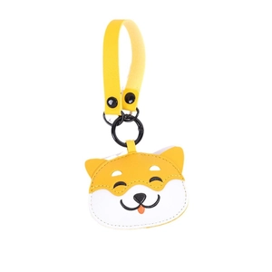 Handcrafted yellow Shiba Inu leather keychain with strap and black metal clasp on white background