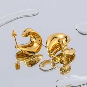 Minimalist twisted geometric earrings in 18K gold plated stainless steel on water surface