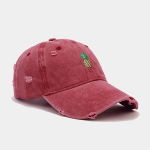 Distressed wash red baseball cap with yellow pineapple embroidery and vintage details