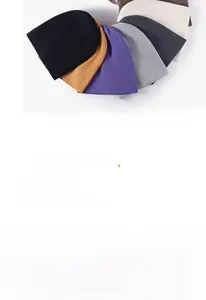 Stack of warm knit beanies in various colors including black, brown, and purple