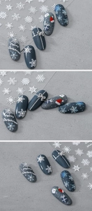 Detailed macro view of 3D embossed white snowflake nail stickers for Christmas decor