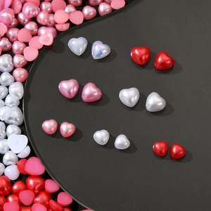 Detail of colorful resin heart beads for nail art and DIY phone cases in various sizes