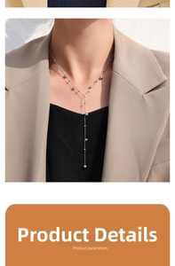 Silver bead tassel necklace on model showing delicate long Y-shaped chain draping