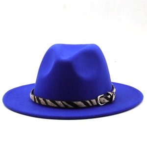Close-up of royal blue wool fedora hat featuring a zebra print band and silver buckle detail